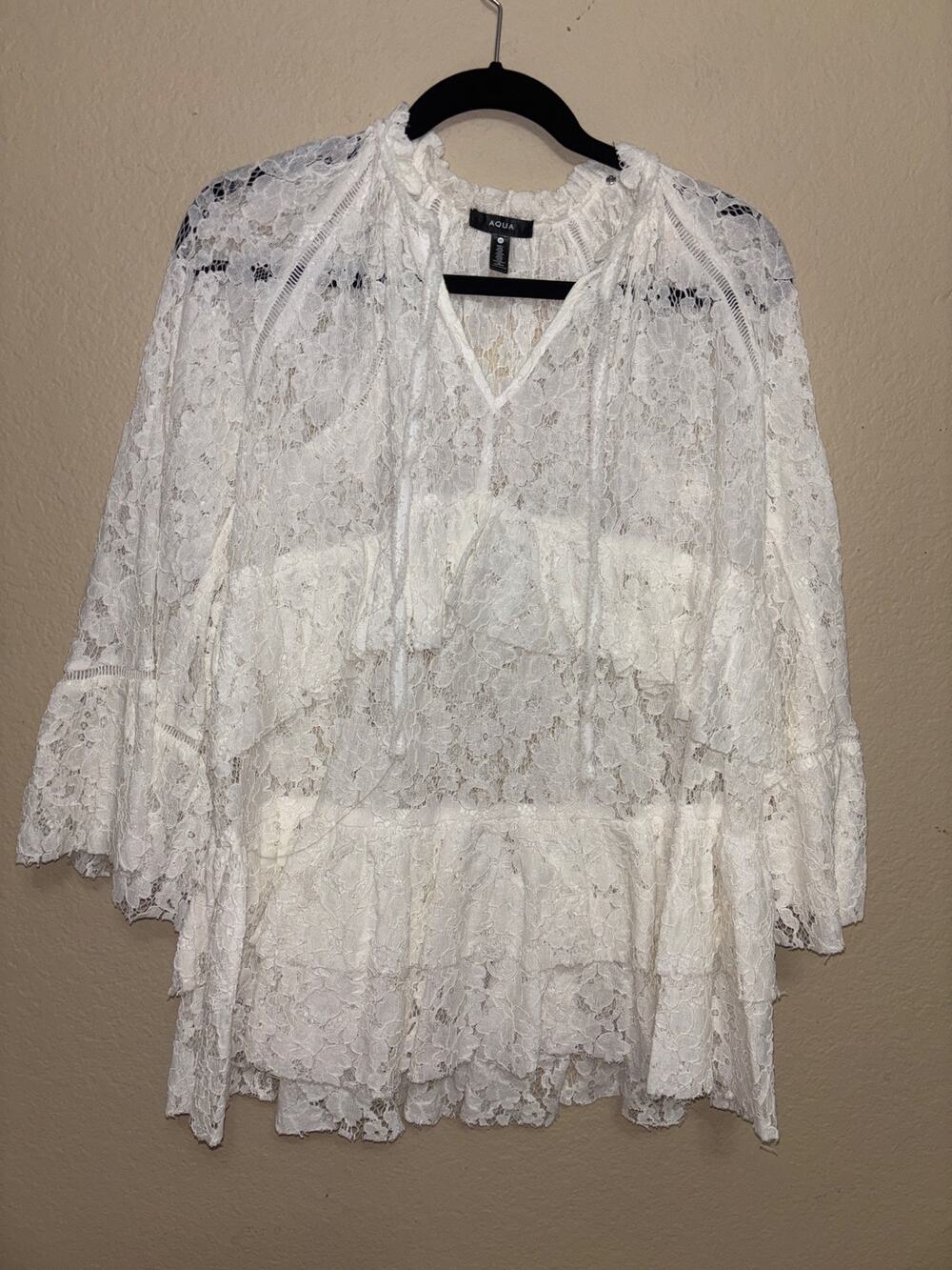 This is an AQUA white lace boho blouse/tunic
